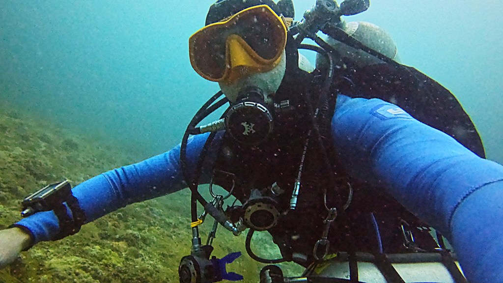 Technical diver during decompression stop with thresher shark, Kimud Shoal